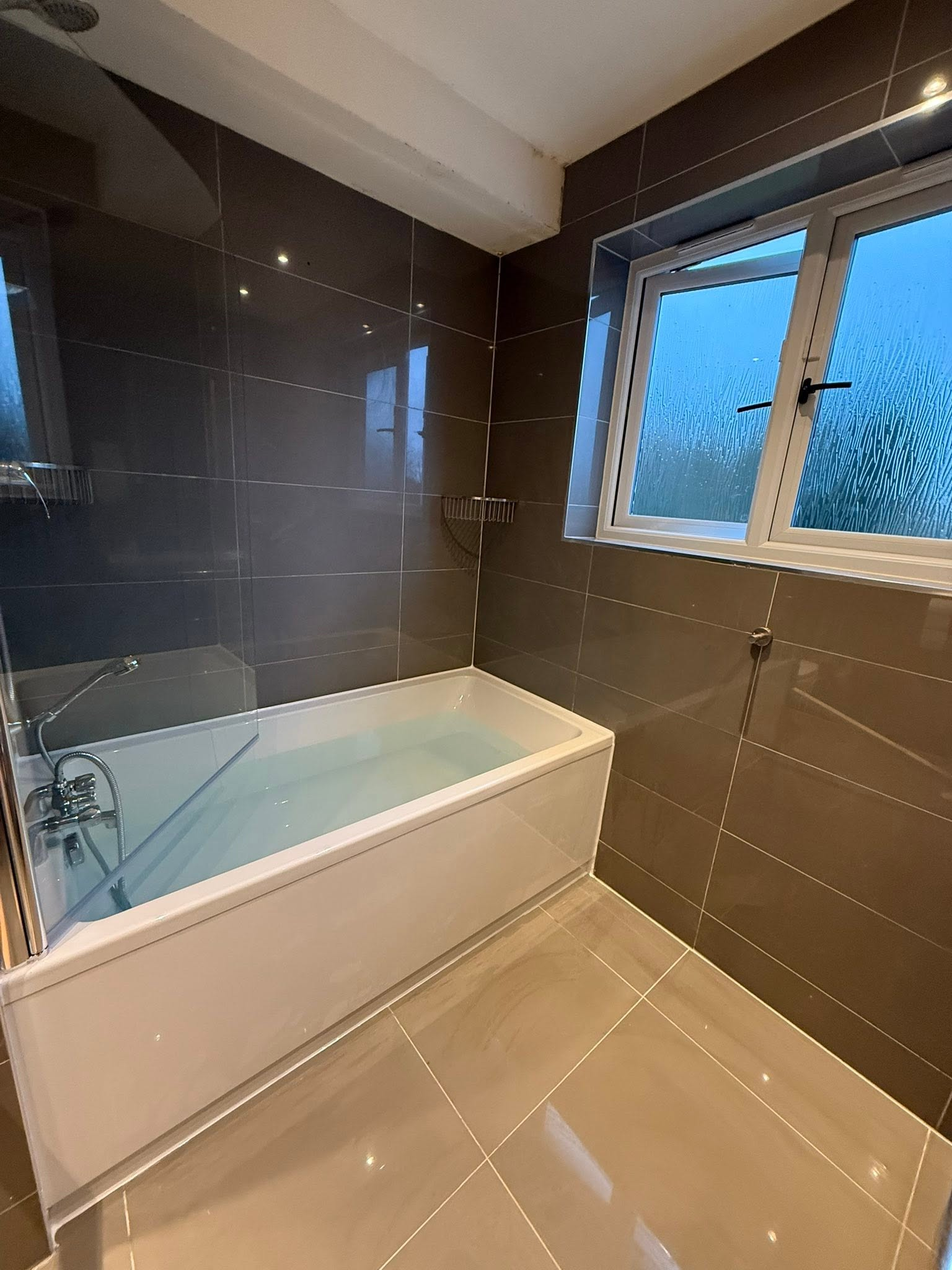 Completed grey tiled bathroom refurbishment