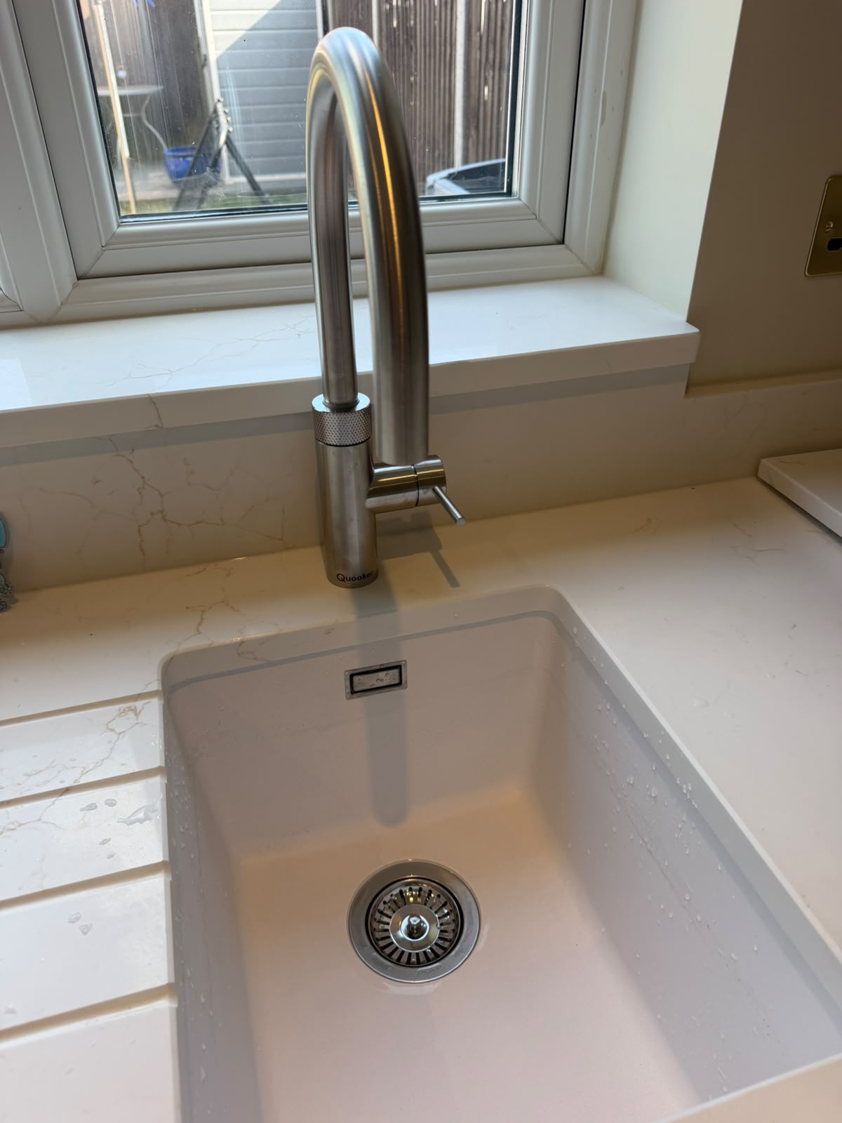 Quooker tap and white kitchen sink installation