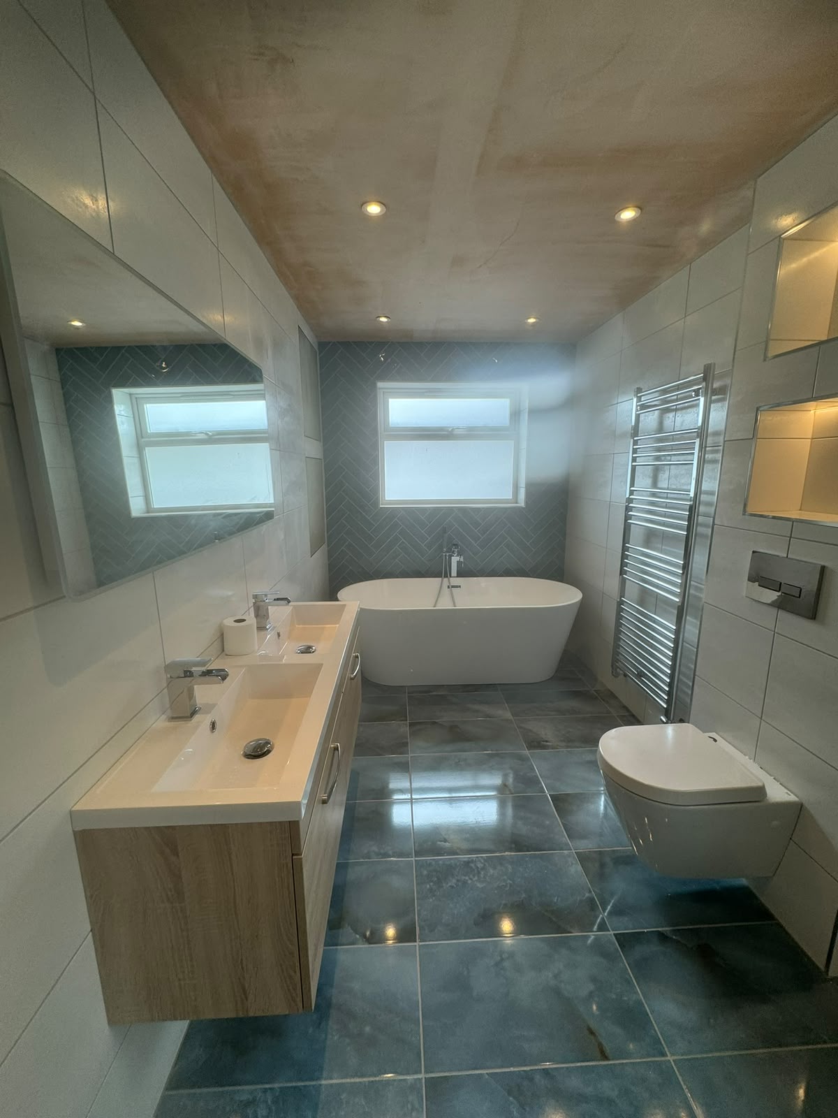 Completed modern bathroom with freestanding bath